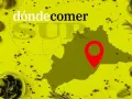 Mapa de Málaga con un pin rojo, indicando dónde comer en Frigiliana. Ingredientes como aceitunas y romero rodean el diseño.