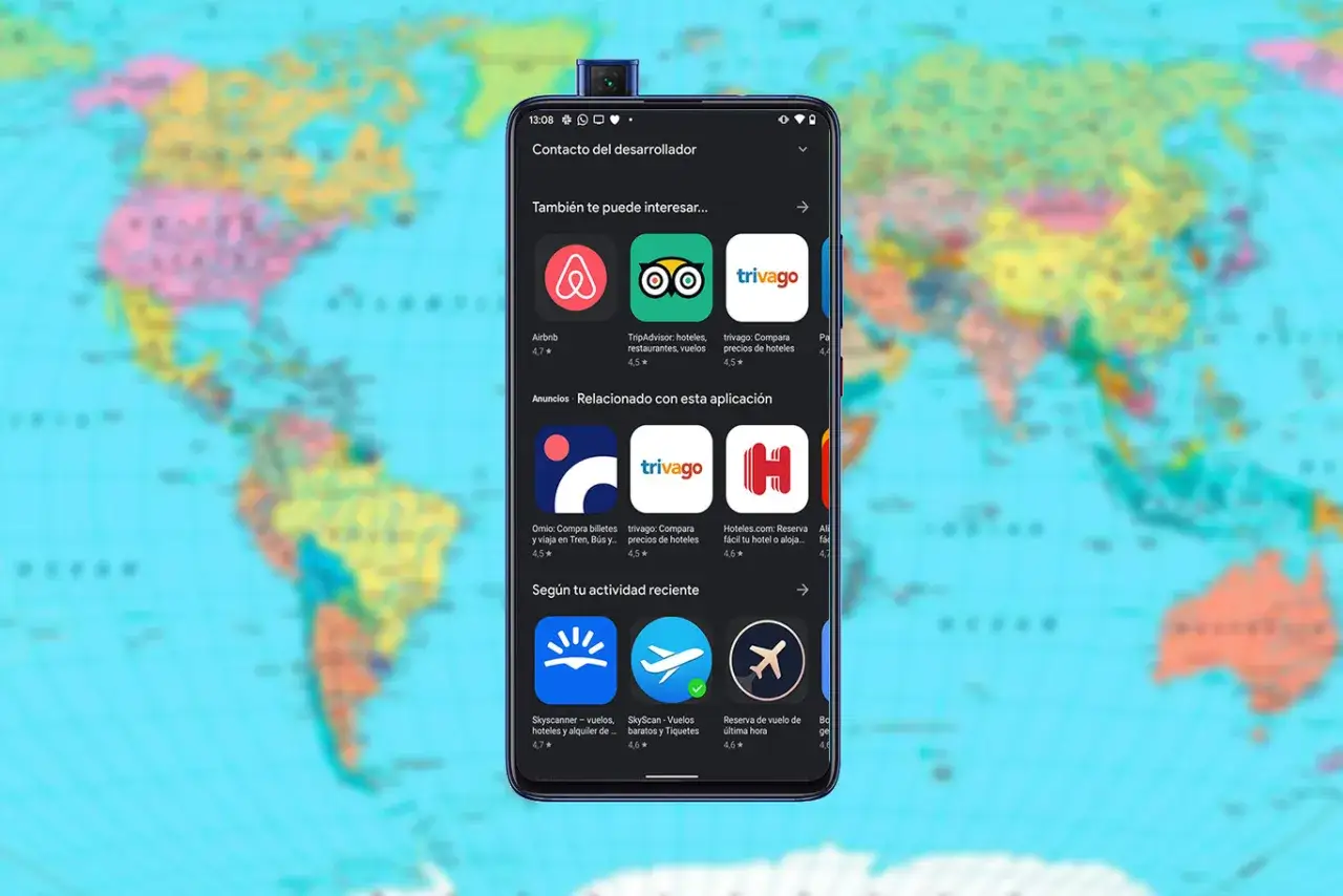 Tel&eacute;fono mostrando aplicaciones para viajar como Airbnb, TripAdvisor y Trivago, con un mapa del mundo de fondo.